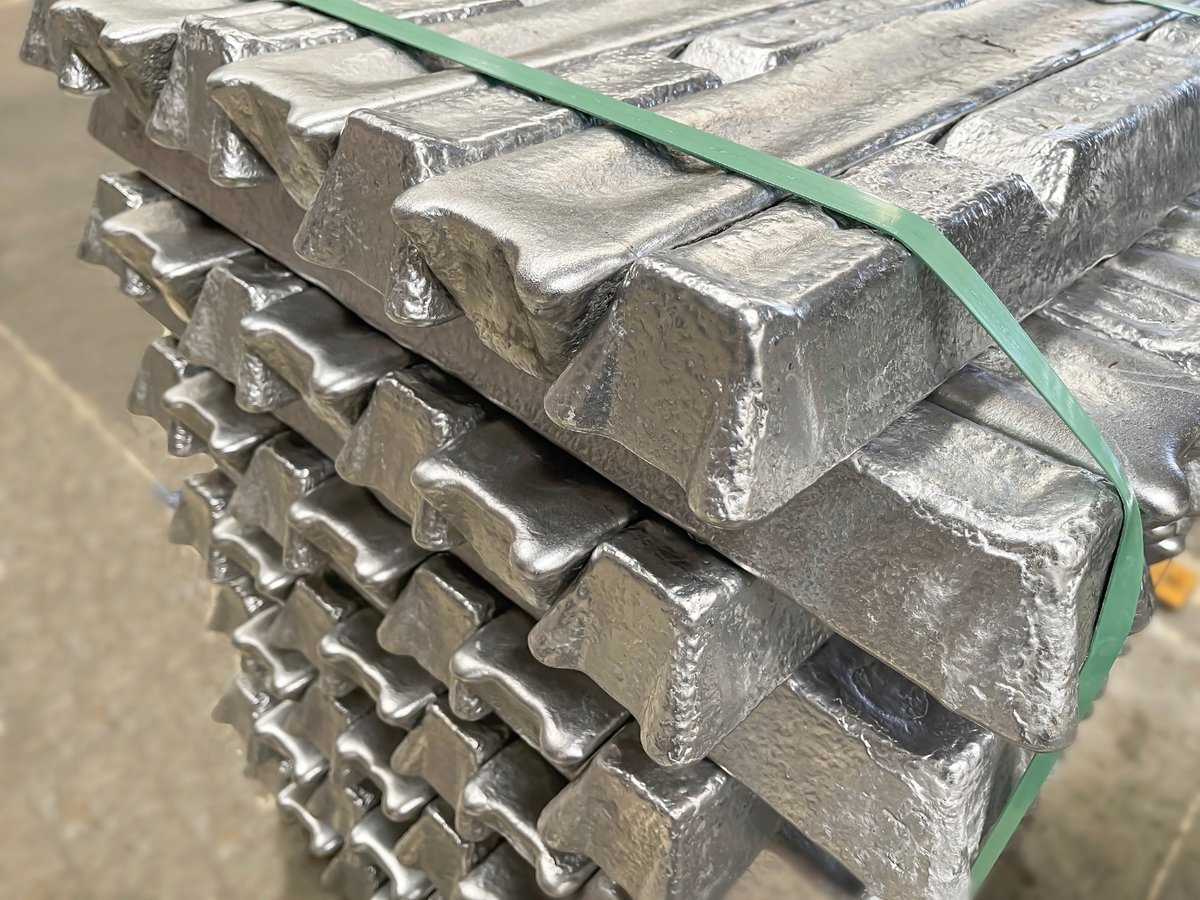 Aluminum ingots stacked on a pallet, raw material ready to be processed