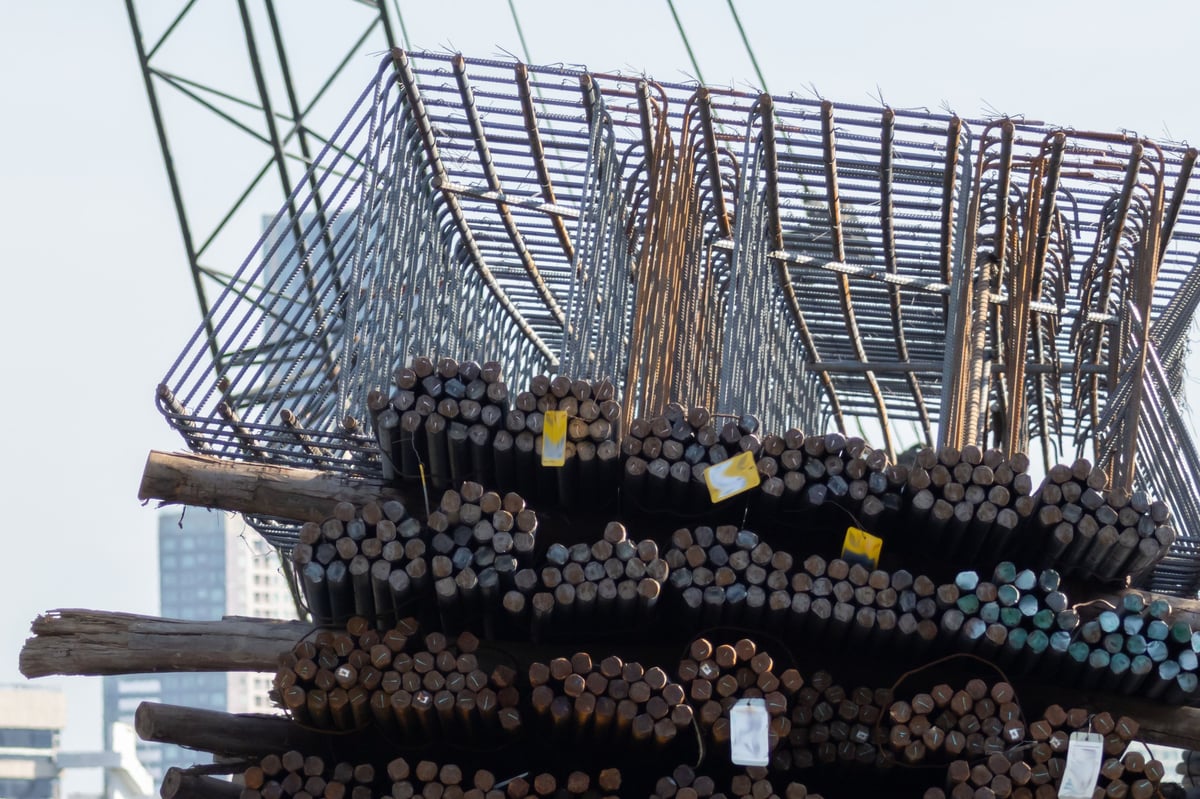 Steel reinforcement bars stacked at a construction site
